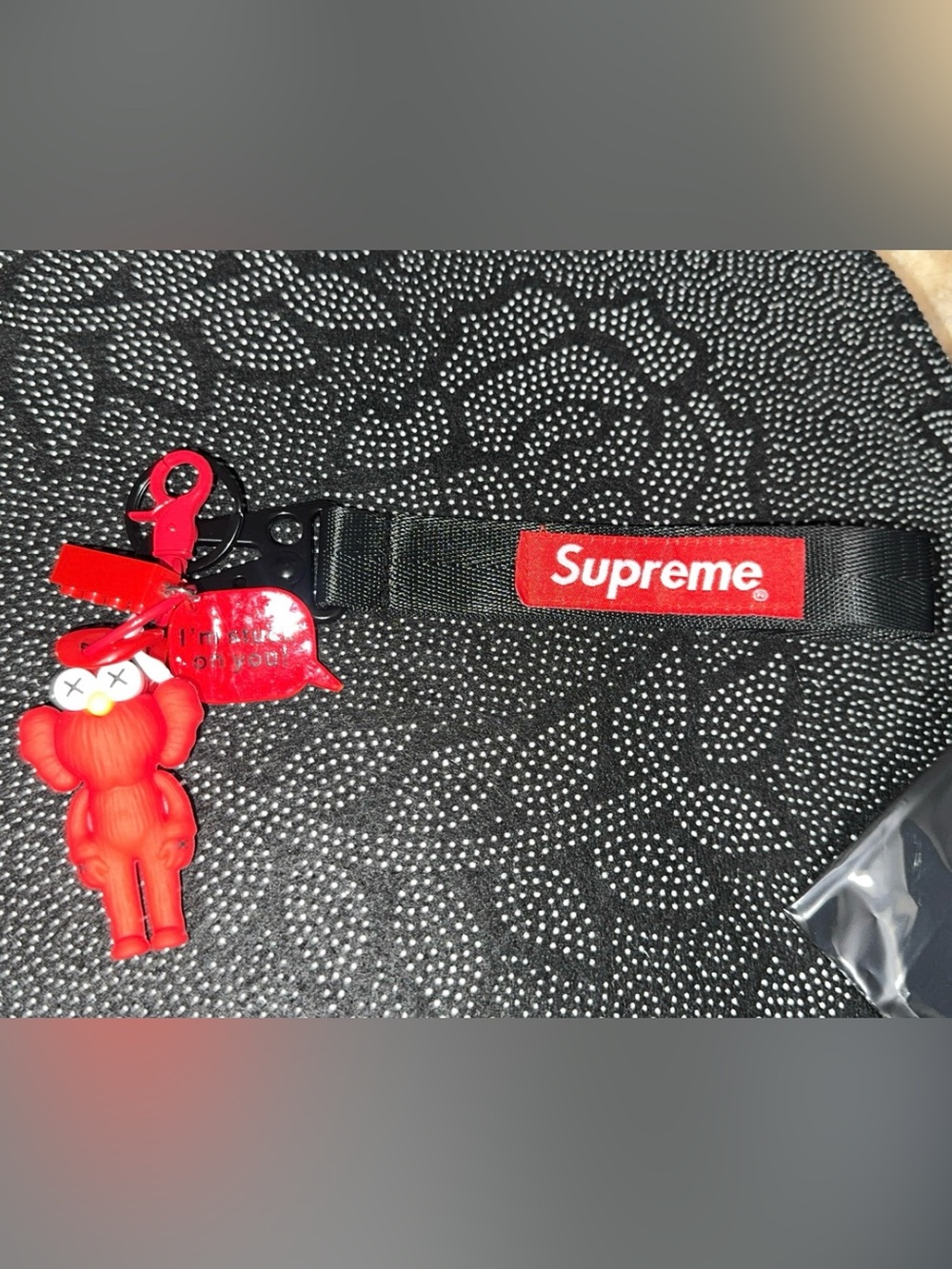 Supreme black strap with red logo keychain